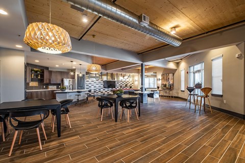 a dining room and kitchen with tables and chairs
