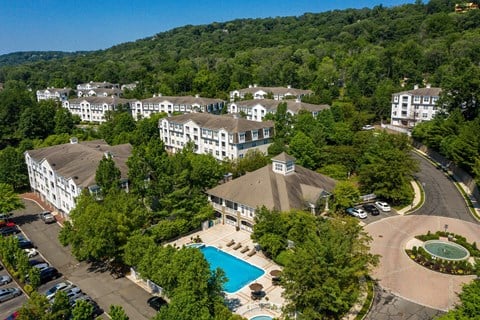 a aerial view of the resort with a swimming pool and buildings