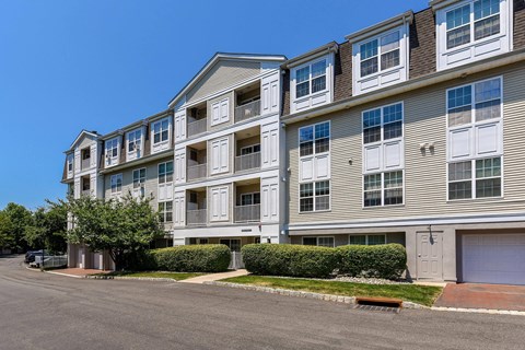 an apartment building with a street in front of it