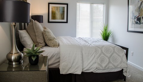 Bedroom with Nightstand at Pine Ridge Apartments, Rochester Hills, MI, 48307
