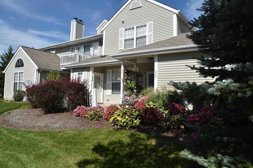 a house with a garden in front of it