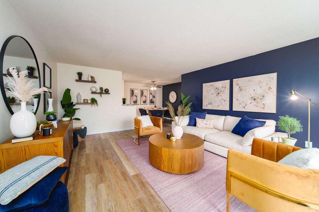 a living room with blue walls and a white couch