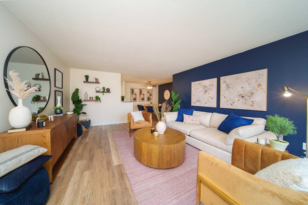 a living room with blue walls and a white couch