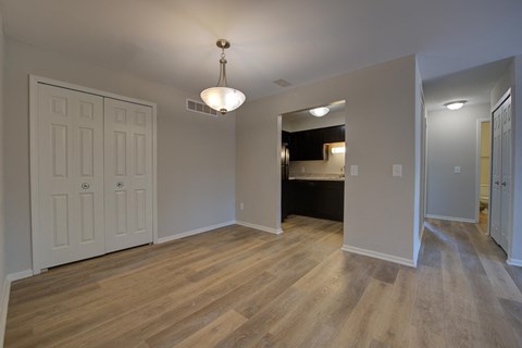 a renovated living room and kitchen in a new home