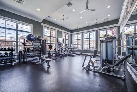 A spacious gym with a variety of equipment and a ceiling fan at Meridian West Shore, Pennsylvania
