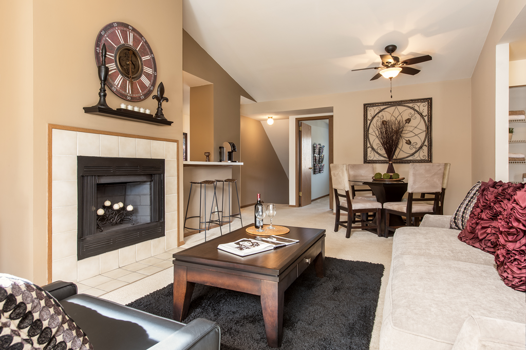 a living room with a fireplace and a couch