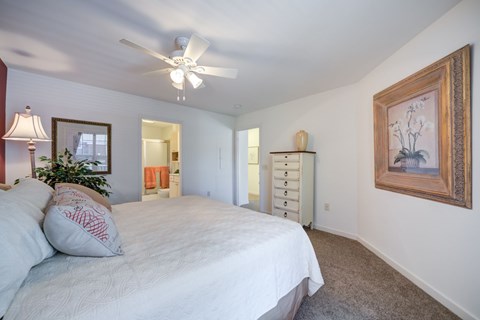 A bedroom with a bed, dresser, and a ceiling fan at The Crest at Elm Tree, Mount Joy, 17552