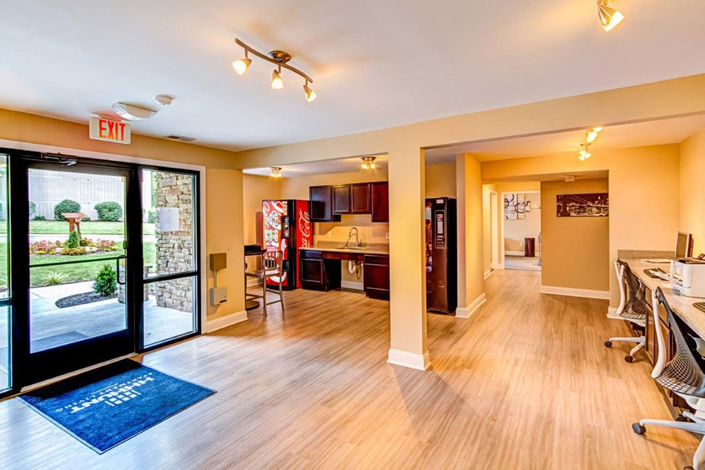 a living room and dining room with a sliding glass door