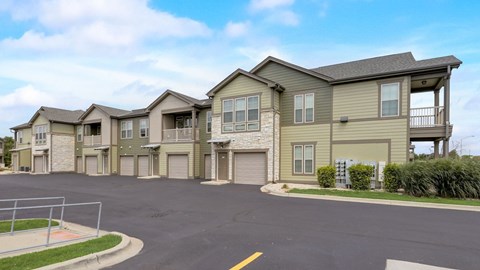 Two story apartment buildings with garages at Reserve at Romeoville, Romeoville, IL