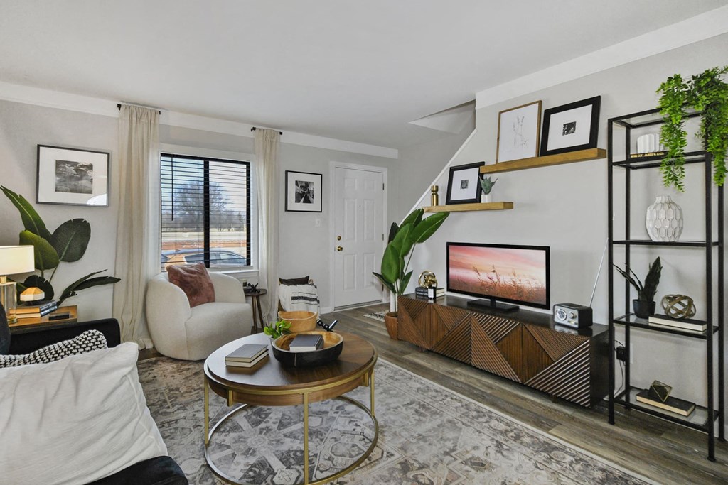 a living room with a couch and a tv