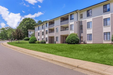 an apartment building on the side of a street