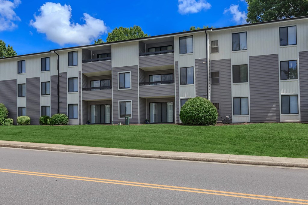 an apartment building on the side of a street