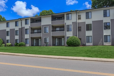 an apartment building on the side of a street