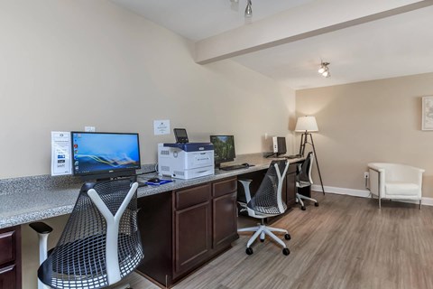 a office with two desks and two computer monitors