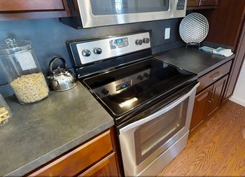 A modern kitchen with a black stove top oven.at Meridian West Shore, Pennsylvania 17055
