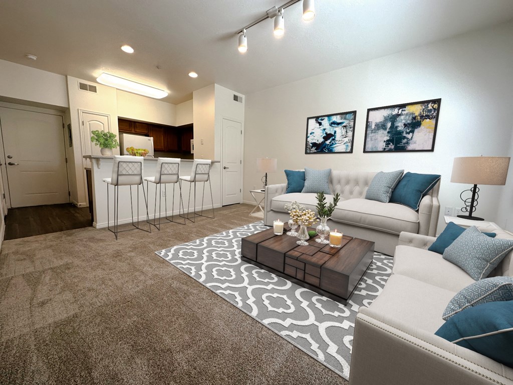 Liberty Landing Apartments Heathrow Floor Plan Living Room with couches, barstools and coffee table. West Jordan, Utah.