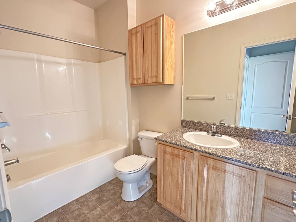 Liberty Bend Townhome Apartments, Sandy, Utah bathroom with a sink toilet and bath tub