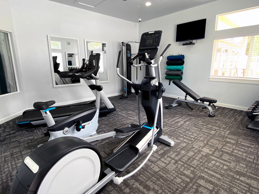 Liberty Hill Apartments, Draper, Utah, gym with a treadmill, elliptical trainer and a stationary bike.