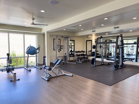 Fitness center with free weights and strength equipment at Liberty Blvd Apartments, Utah