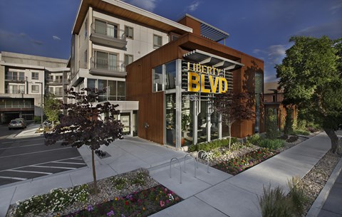 A modern building with the sign "Liberty Blvd" in front of it.