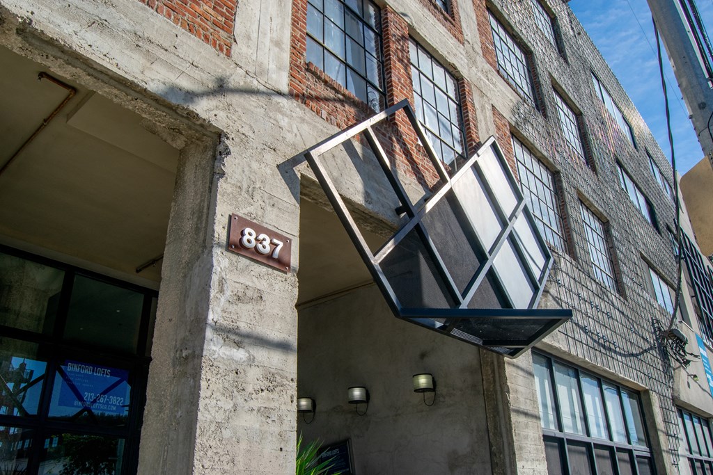 the facade of a building with a street light on the side of it at Binford Lofts Apartments, California