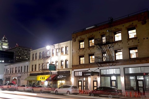 a row of buildings on a city street at night at Mikado Little Tokyo, California 