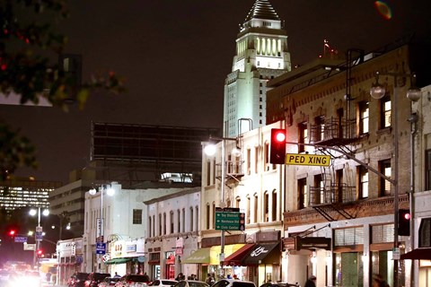 a city street at night with a traffic light at Mikado Little Tokyo, California, 90012