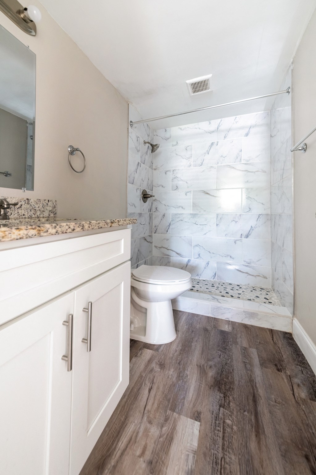 an image of a bathroom with a toilet and a shower at Palm Cove Apartments, Daytona Beach, 32114