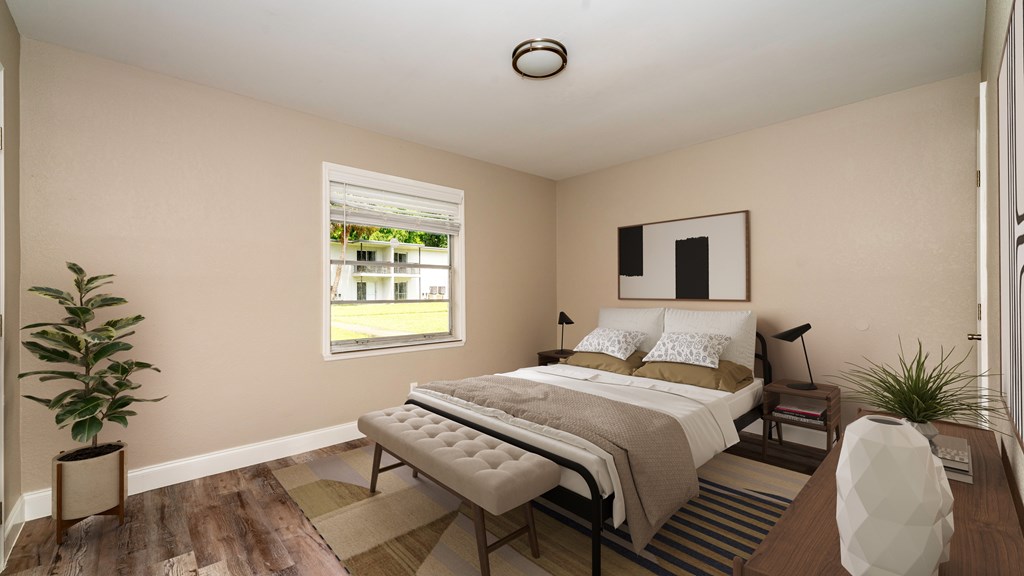 A bedroom with a large bed and a window.