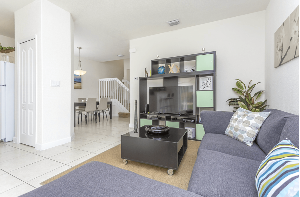 a living room with a couch and a table