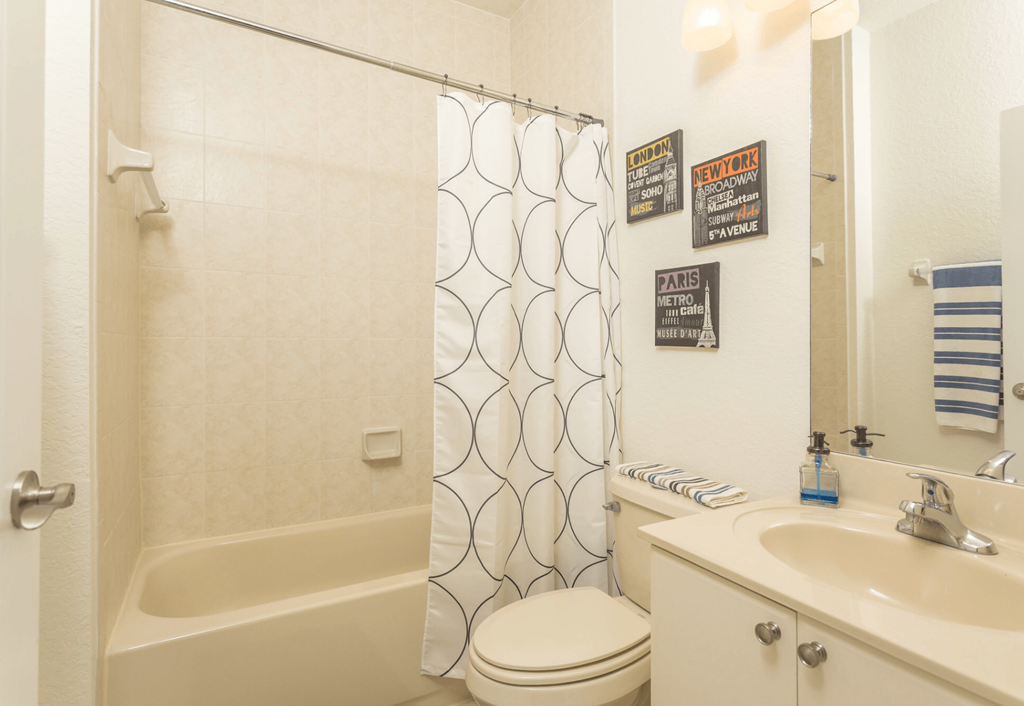 a bathroom with a sink toilet and bathtub