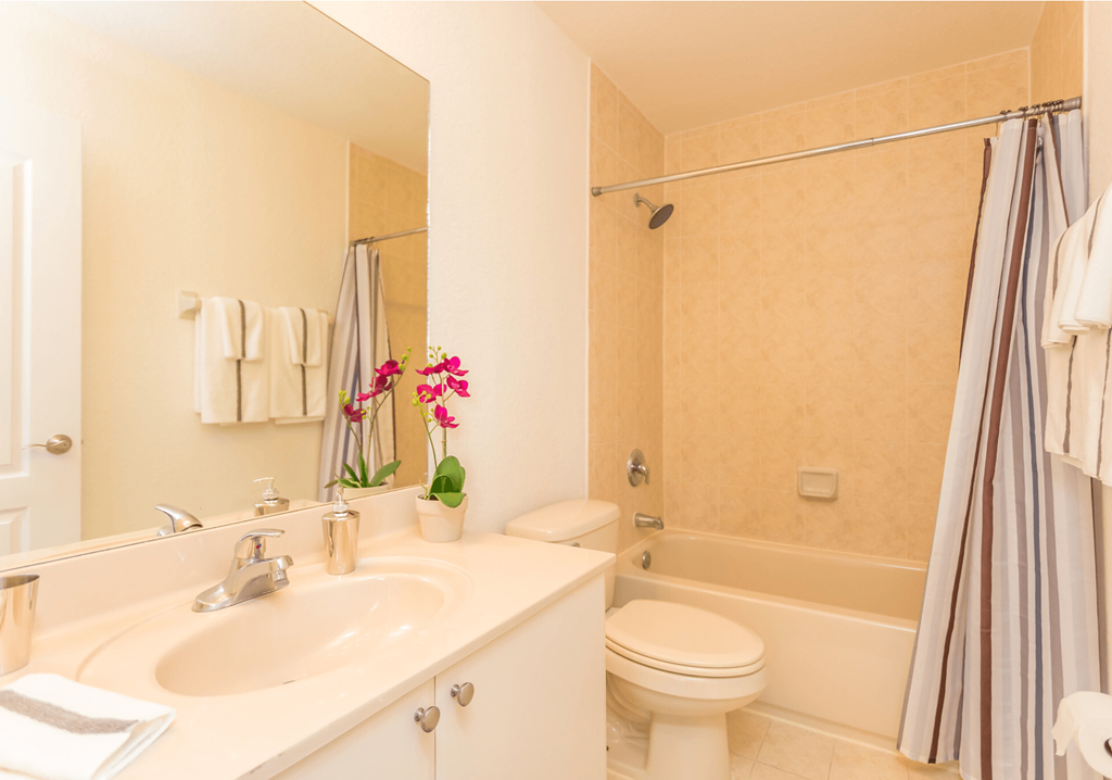 a bathroom with a sink toilet and bathtub
