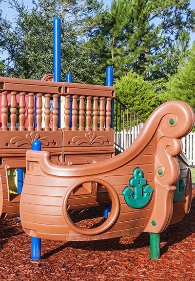Playground area for children at Enterprise cove apartments in Orange City, FL