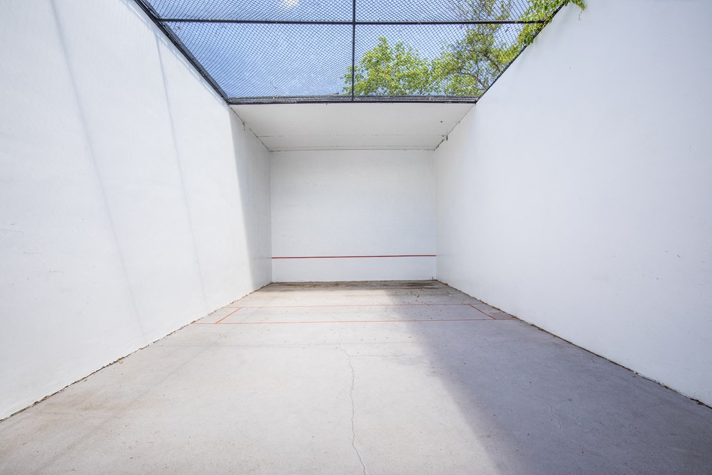a white room with a glass ceiling and a walkway at Lakeside Gardens, Daytona