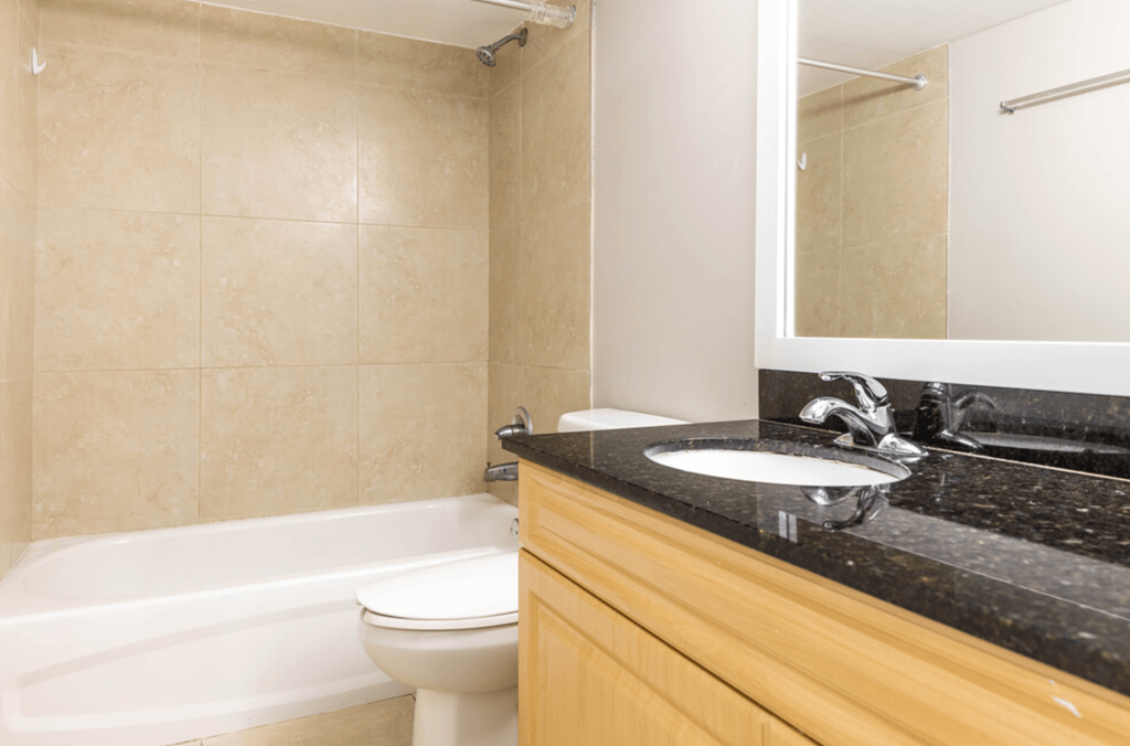 a bathroom with a sink toilet and bathtub at Lakeside @ Biscayne Gardens,North Miami,33181