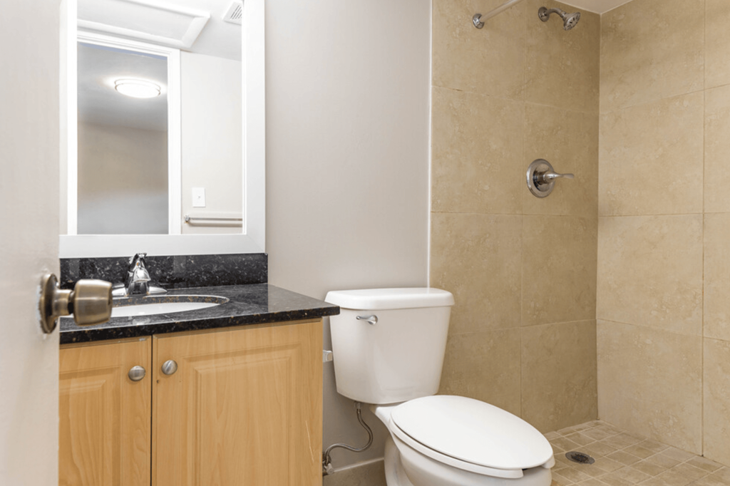 a bathroom with a toilet sink and shower at Lakeside @ Biscayne Gardens,North Miami, Florida,33181