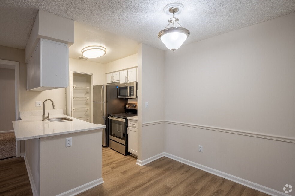 an empty kitchen with an island and a stainless steel at Lakeside Gardens, Daytona, FL 32114