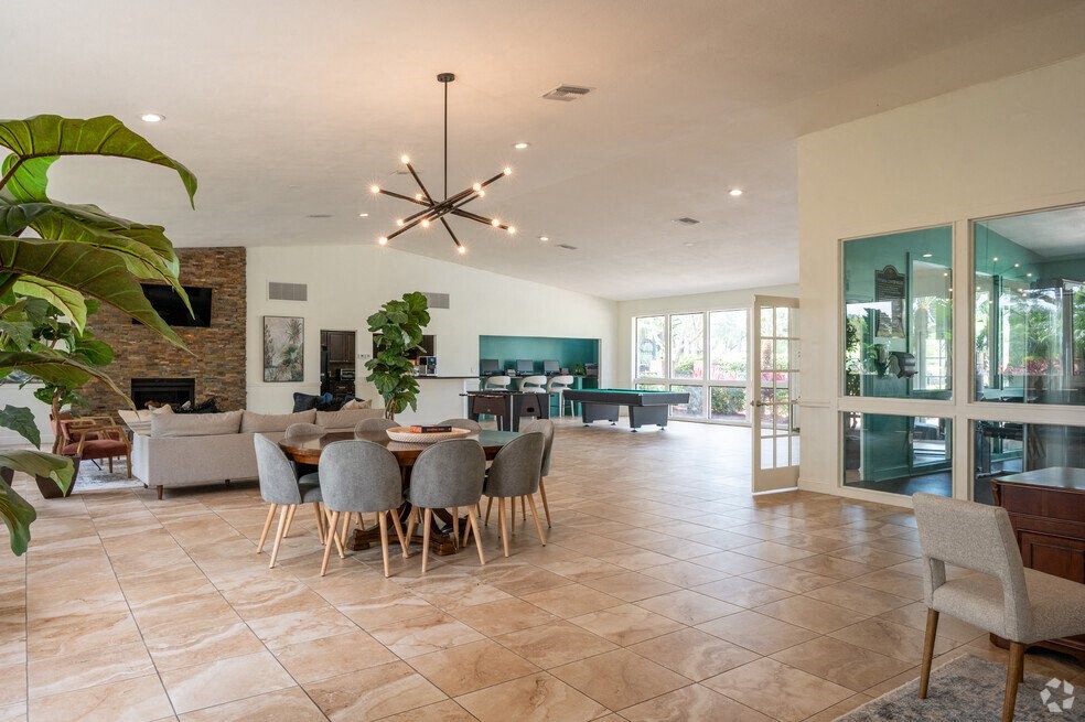 a living room and dining room with a table and chairs at Lakeside Gardens, Florida, 32114