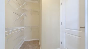 Empty white shelves in a room.