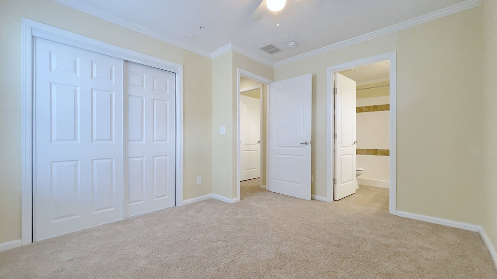 A white door is in a room with beige walls. A white door is in a room with beige walls.