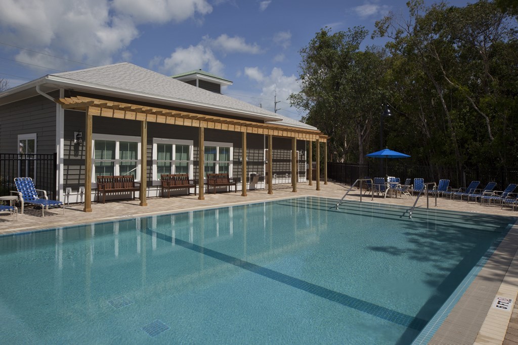 A pool with a building next to it.