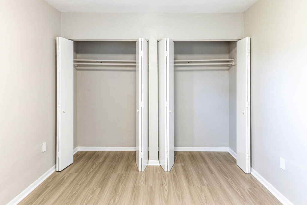an empty bedroom with two closets at Lakeside @ Biscayne Gardens,North Miami, FL