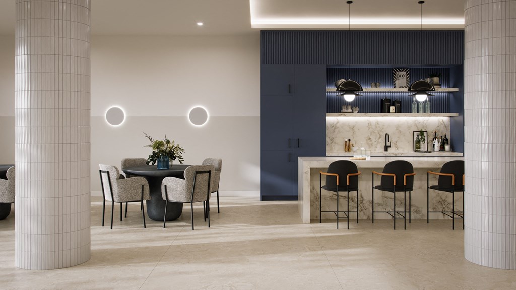 a dining room with tables and chairs and a bar