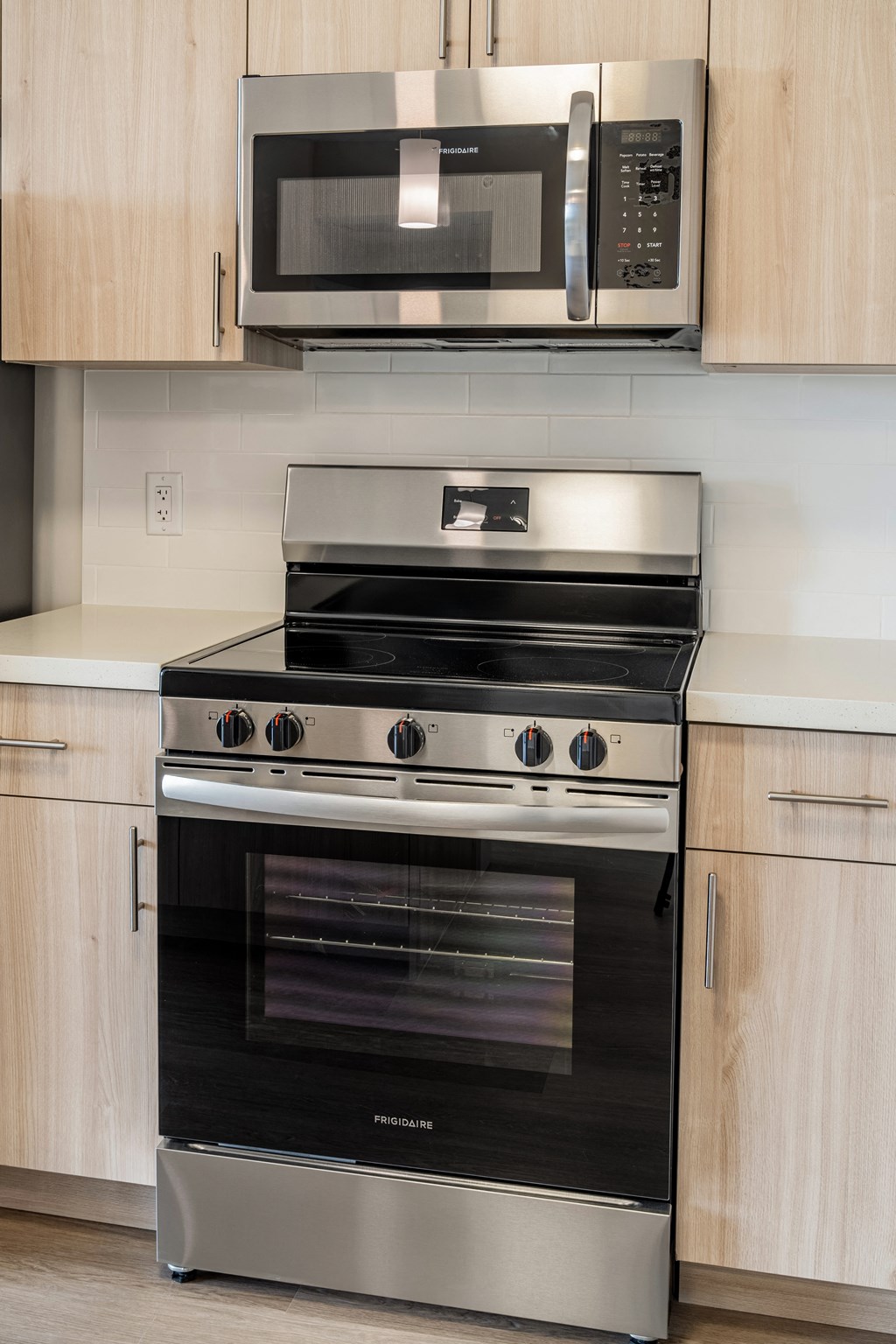 a kitchen with a stove and a microwave