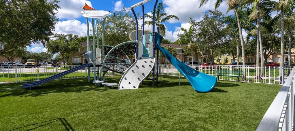 a playground with a slide and a swing set