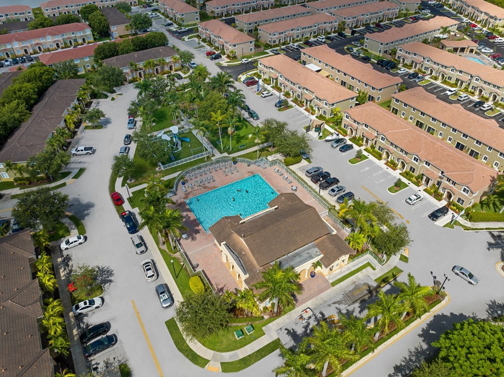 an aerial view of a resort with a swimming pool
