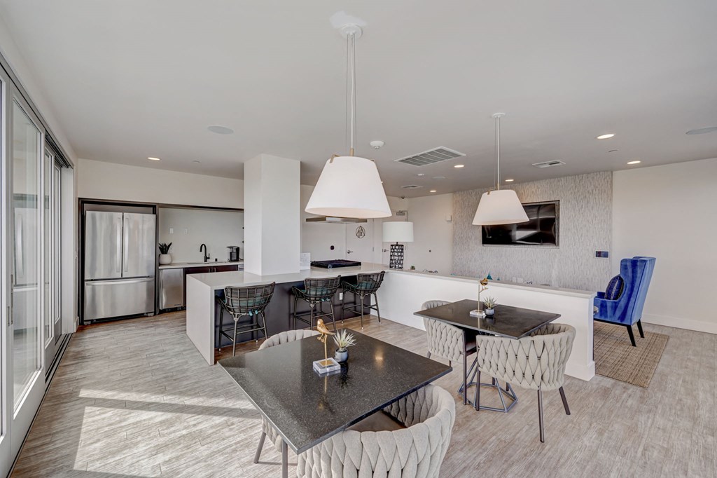 Living room and kitchen with table and chairs