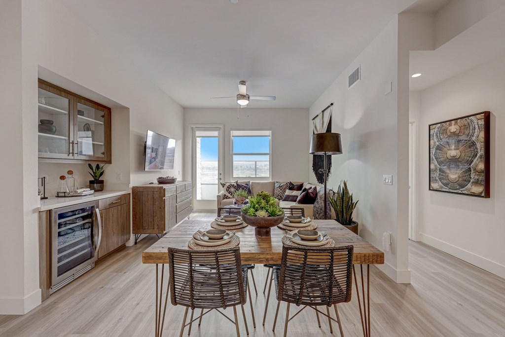 Open kitchen with island and three stools.