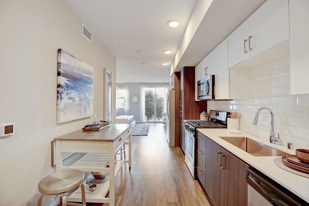 a kitchen with a counter top and a sink