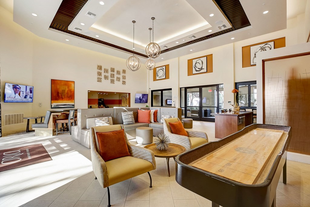 a living room with furniture and a table